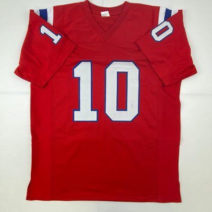 Autographed/Signed Mac Jones New England Red Football Jersey Beckett BAS COA