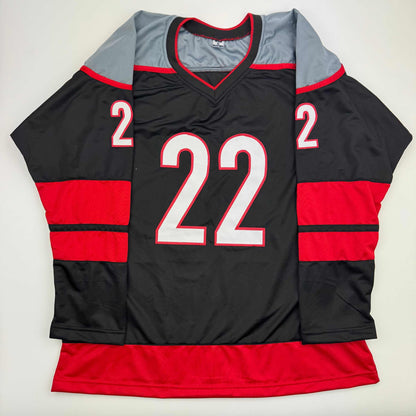 Autographed/Signed Logan Stankoven Carolina Black Hockey Jersey Beckett BAS COA
